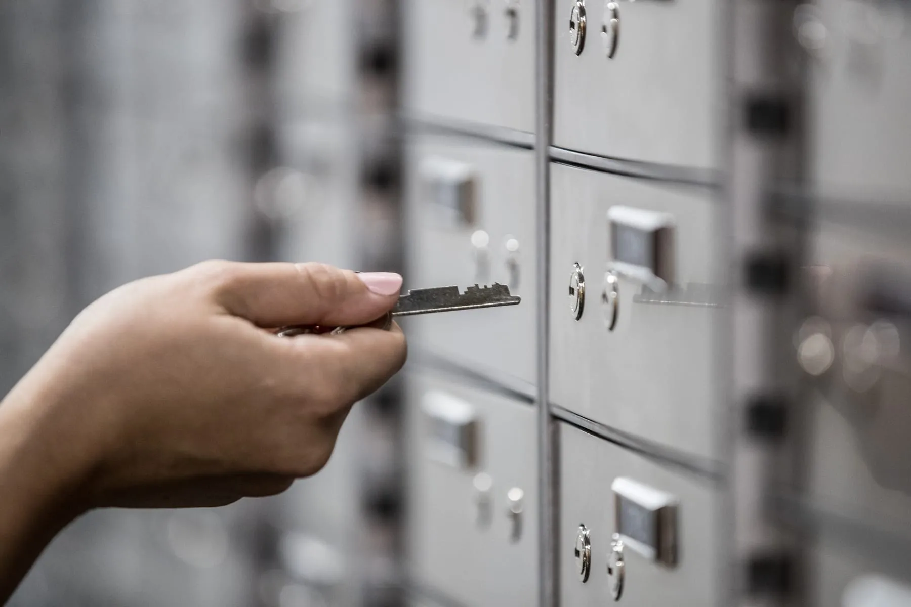 Client opening a private safety deposit box with their registered key
