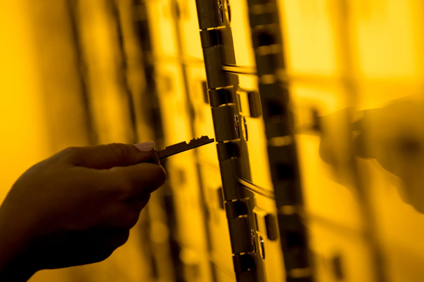 Client holding a registered safety deposit box key